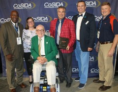 Pictured with CoSIDA Hall of Famer and former Gettysburg College SID Bob Kenworthy (front) is a group of Kenworthy Community Service Award recipients at the 2018 CoSIDA Convention at the Gaylord National Resort (National Harbor, Maryland): L to R (Bill Hamilton, South Carolina State, 1998 recipient); Willson (2006 recipient); Chris Wenzler (John Carroll, 2018 recipient) and Sam Atkinson (Gallaudet, 2014 recipient) and Ken DeBolt (Hobart and William Smith Colleges, 2015 recipient).